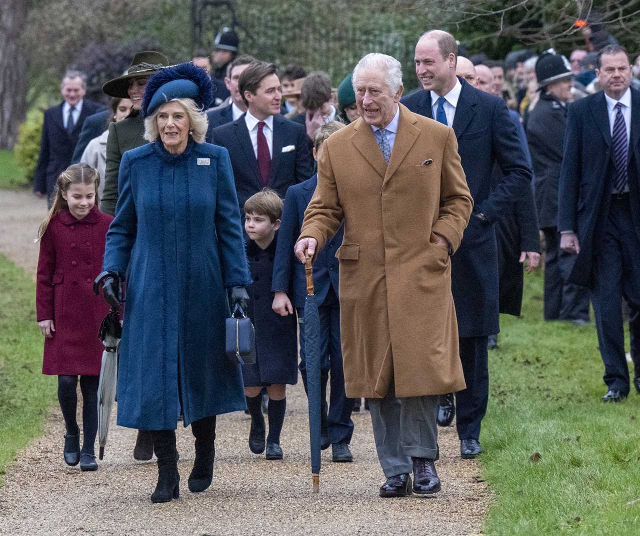 Prince Louis steals the show at Sandringham Christmas walk as delighted crowds shower him with gifts