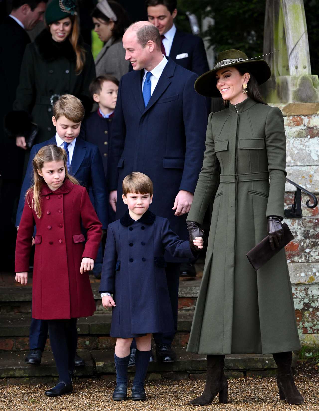 Prince Louis steals the show at Sandringham Christmas walk as delighted crowds shower him with gifts