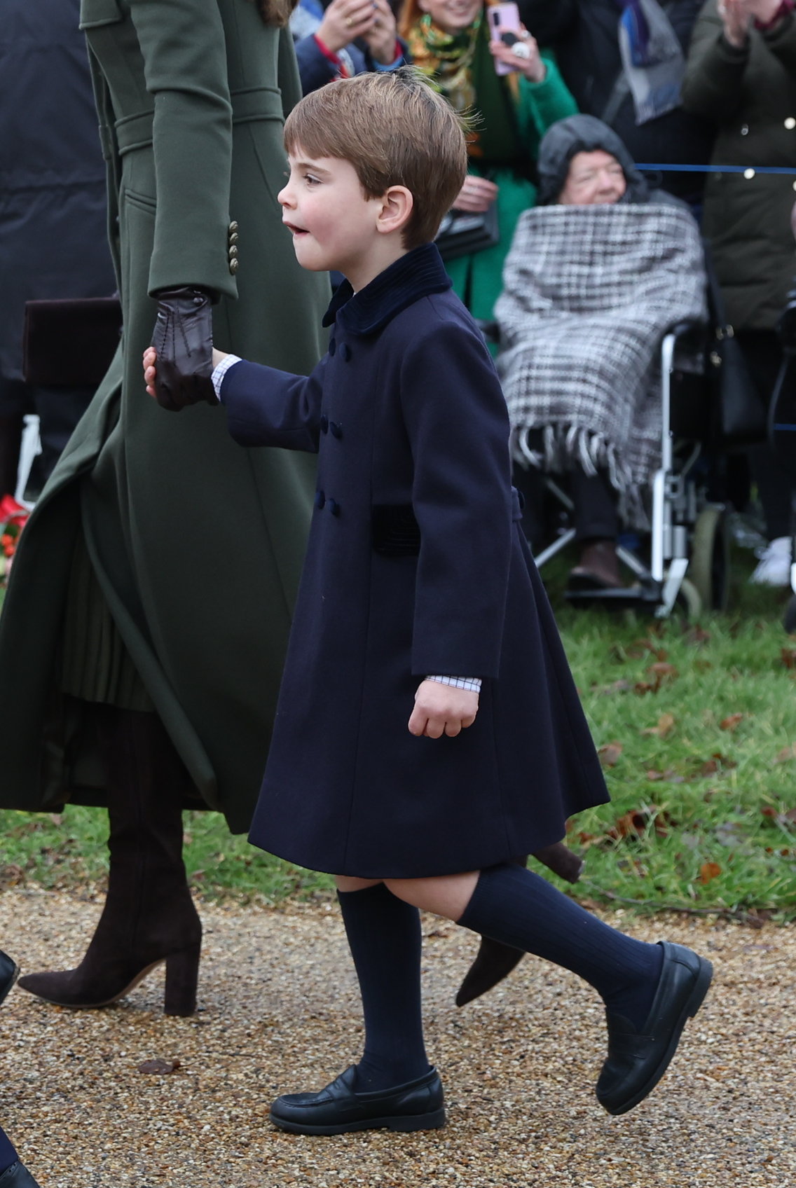 Prince William, Kate, George, Charlotte and Louis beam with festive smiles as they join King Charles on Christmas walk