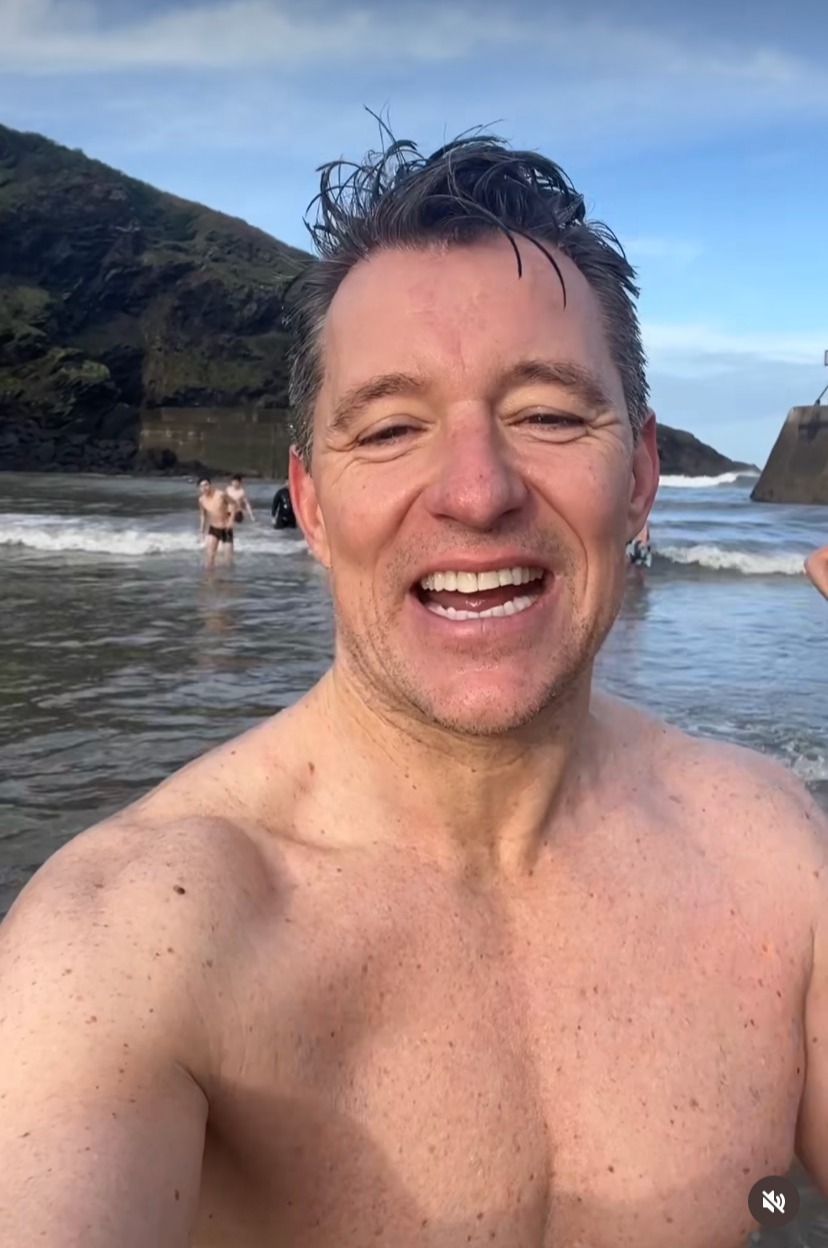 Topless Ben Shephard strips down to his trunks for freezing cold swim in the sea on Christmas holiday in Cornwall