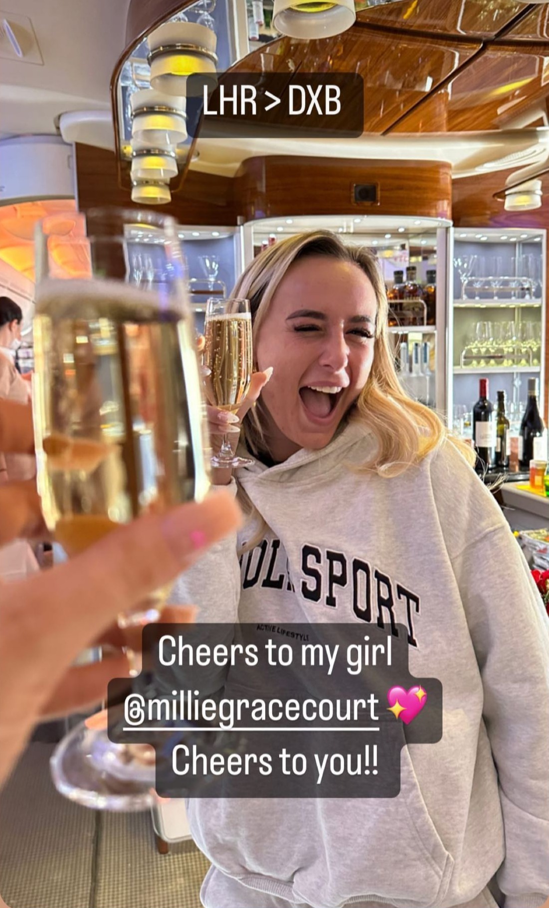 Love Island’s Millie Court downs five champagnes and flies first class on 14th holiday of the year to Dubai