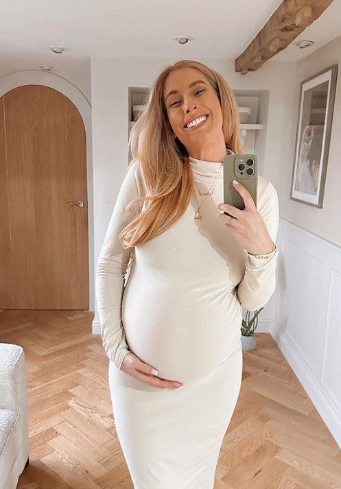 Pregnant Stacey Solomon is glowing as she cradles her bump in figure-hugging dress