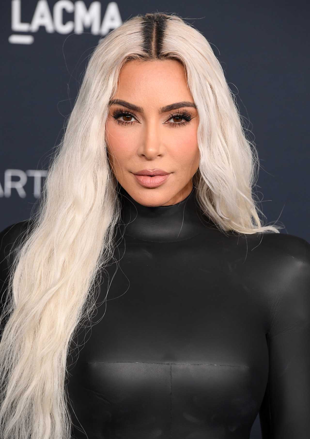 Kim Kardashian’s real skin sneakily caught on camera as fan takes new unedited photos during star’s visit to small town
