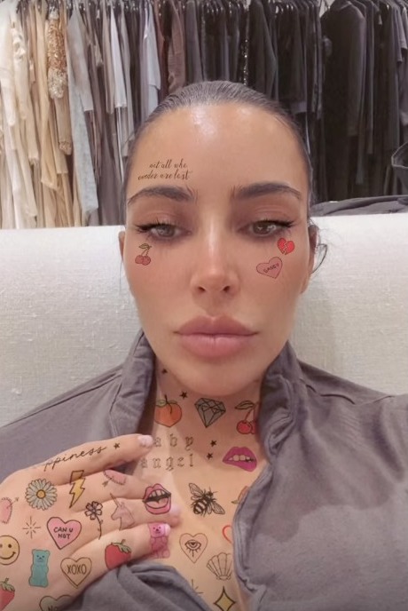 Kim Kardashian shows off intricate face & neck ‘tattoos’ in shocking new video after ex Kanye West’s ‘secret wedding’