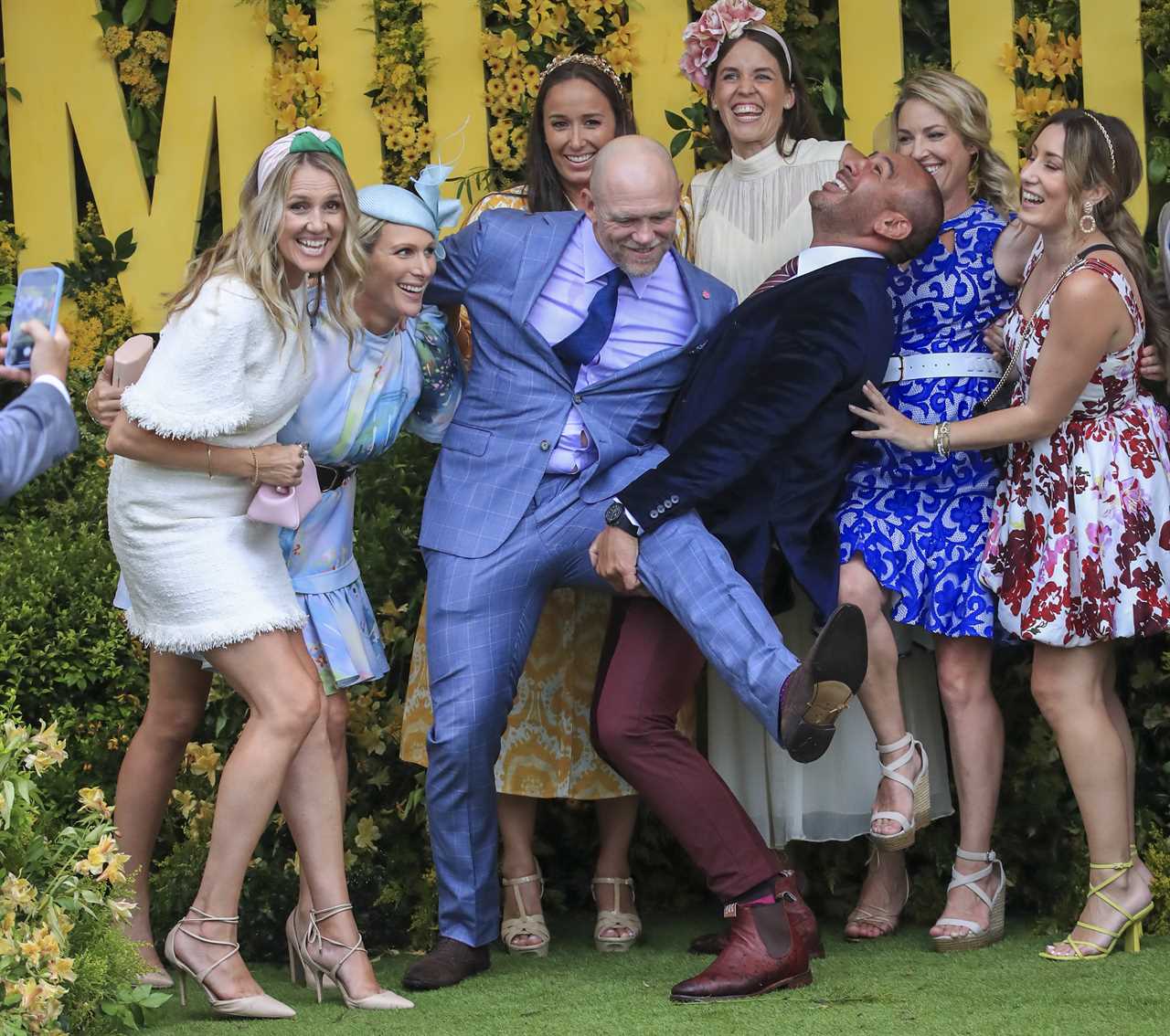 Zara and Mike Tindall put on a very PDA display as they attend the Magic Millions race day in Australia