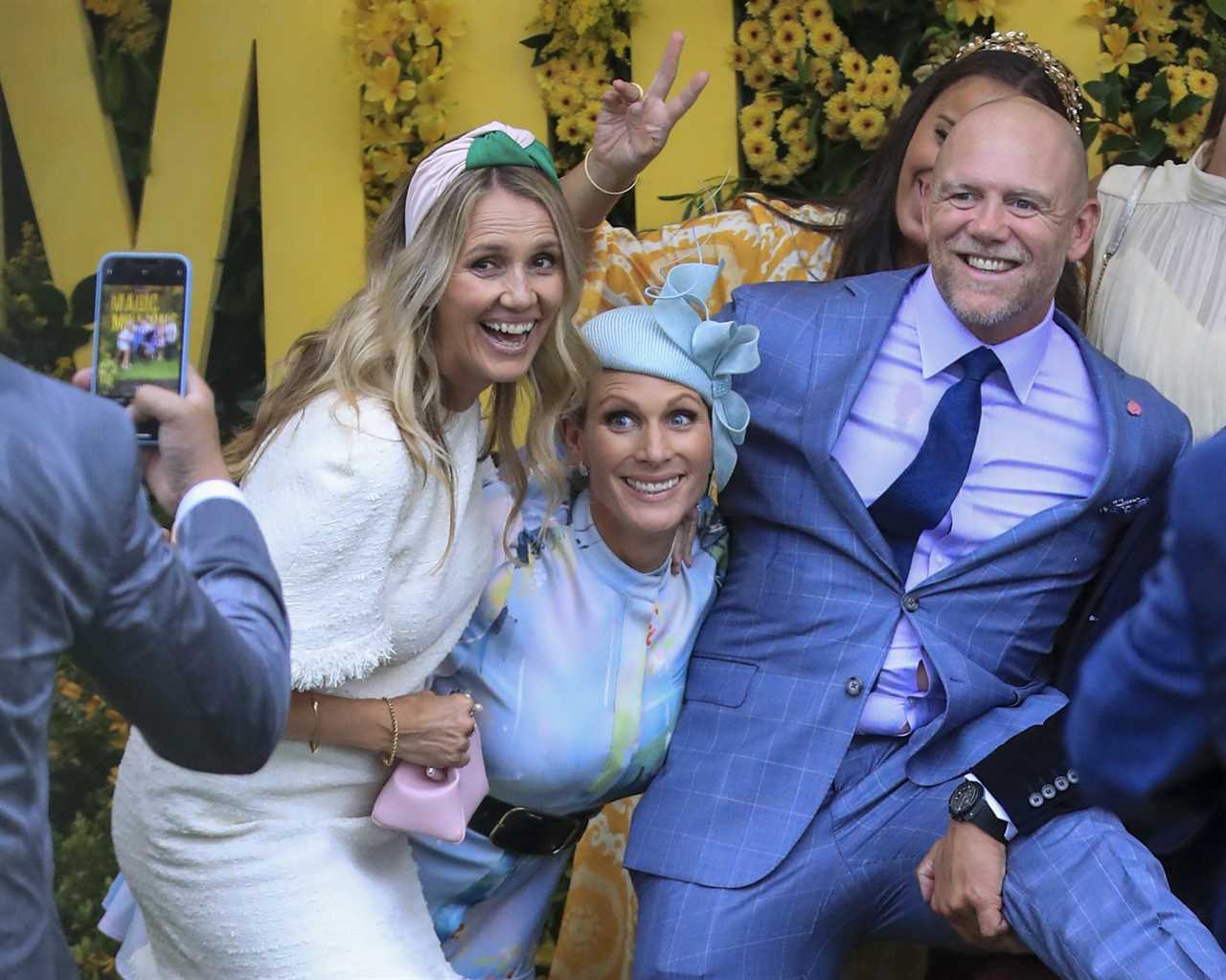 Zara and Mike Tindall put on a very PDA display as they attend the Magic Millions race day in Australia