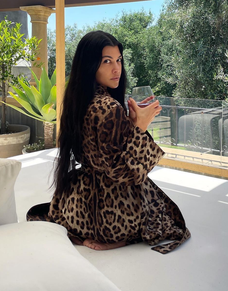 Kourtney Kardashian goes pantless in extremely short cotton robe for new photo after ‘relaxing’ day at the spa