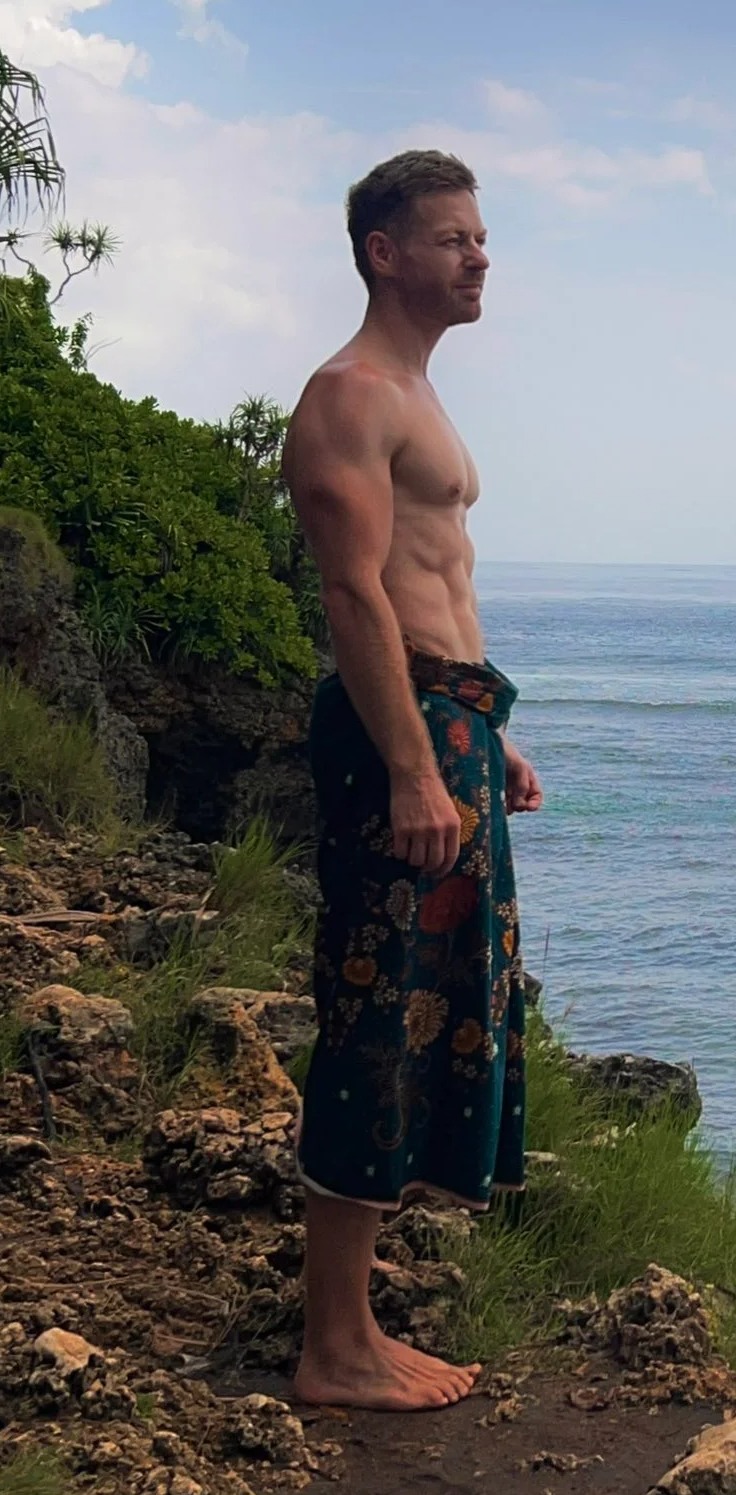 Hunky BBC weatherman drives fans wild as he poses topless on Bali beach and shows off rock-hard abs