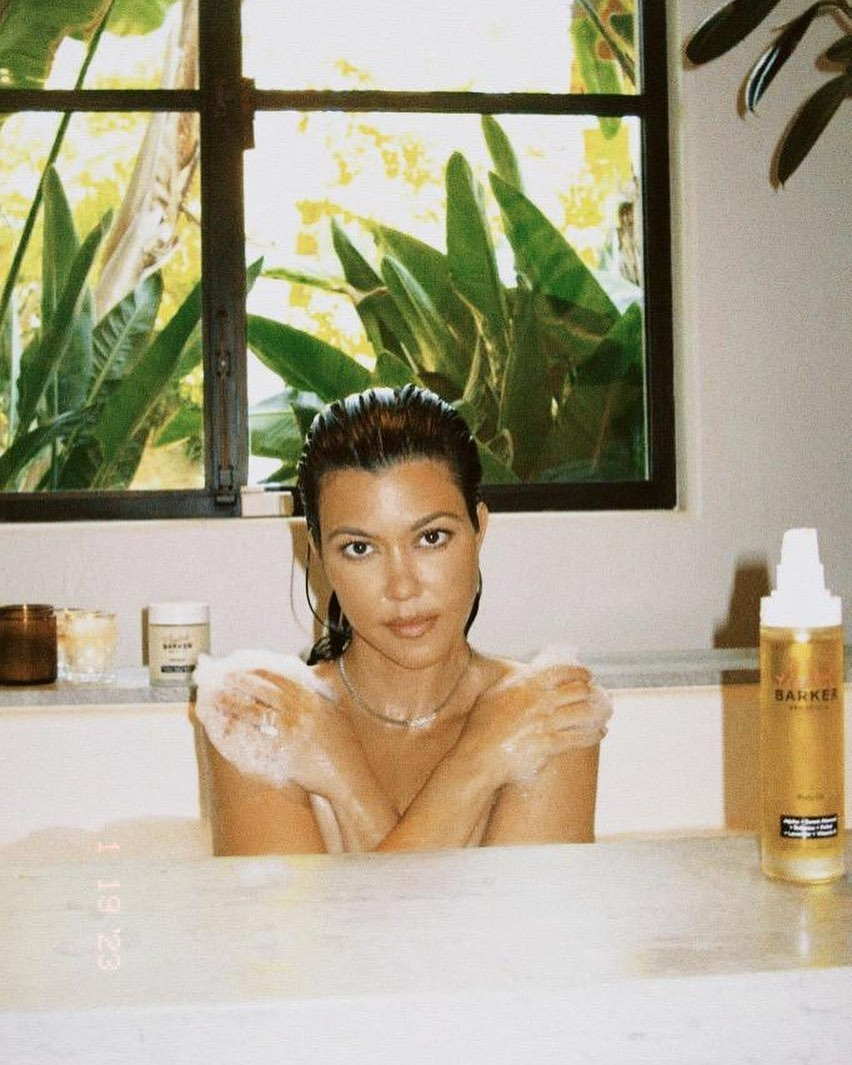 Kourtney Kardashian goes totally naked in the bath in sexy new ad for husband Travis Barker’s wellness brand