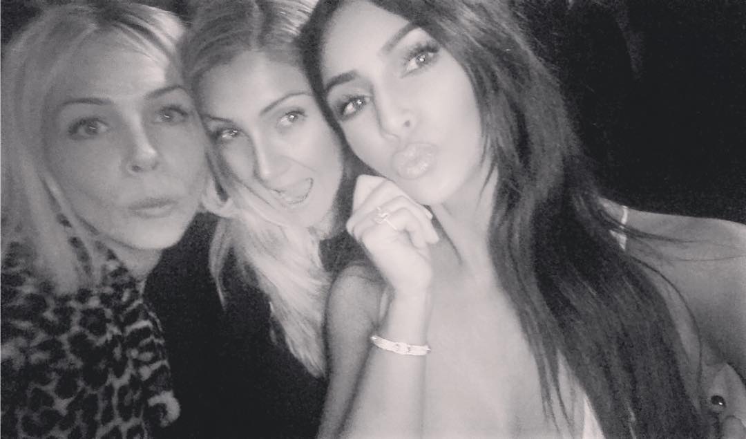 Kim Kardashian looks totally unrecognizable as she snuggles up to ‘life long’ pals in makeup-free new photo