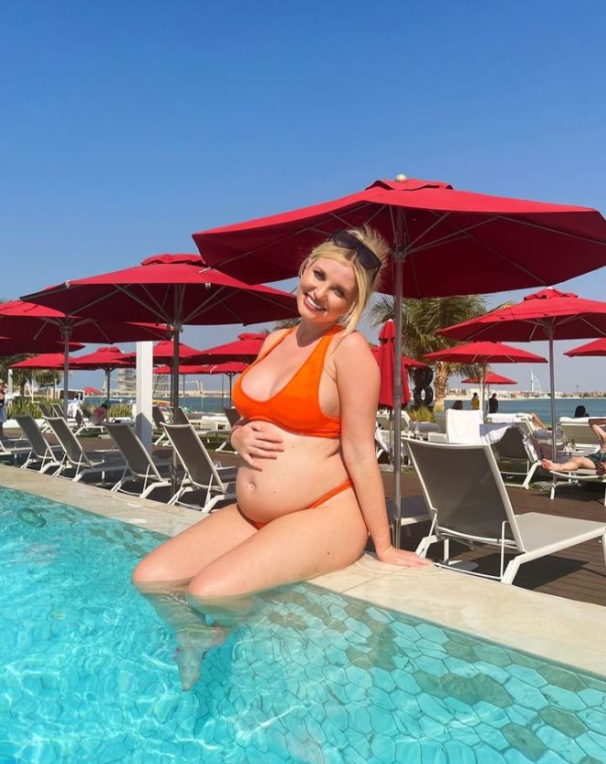 Love Island’s Amy Hart keeps fans guessing by posing with ‘baby’ as she prepares to welcome first child