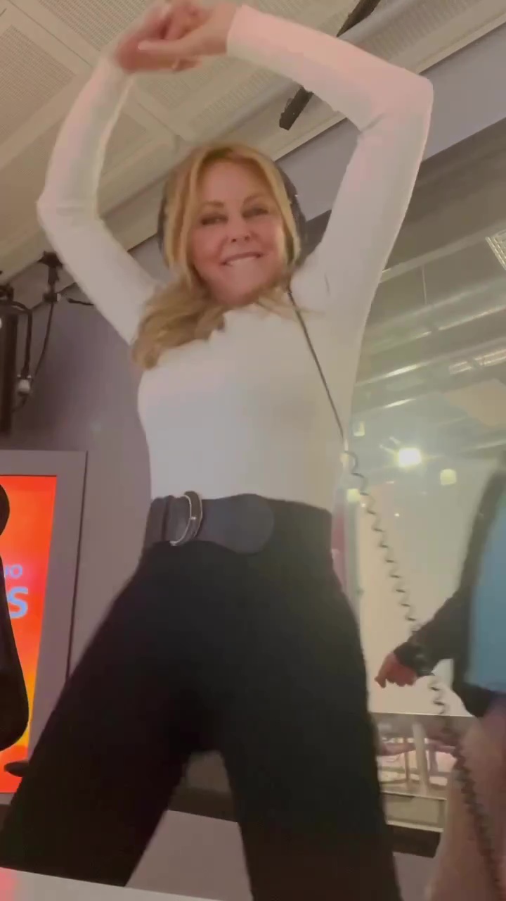 Carol Vorderman shows off impressive figure in tight-fitting leggings as she dances round radio studio