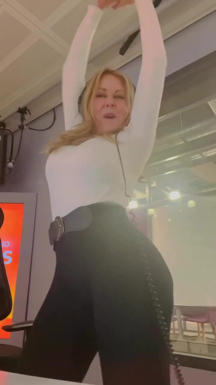 Carol Vorderman shows off impressive figure in tight-fitting leggings as she dances round radio studio