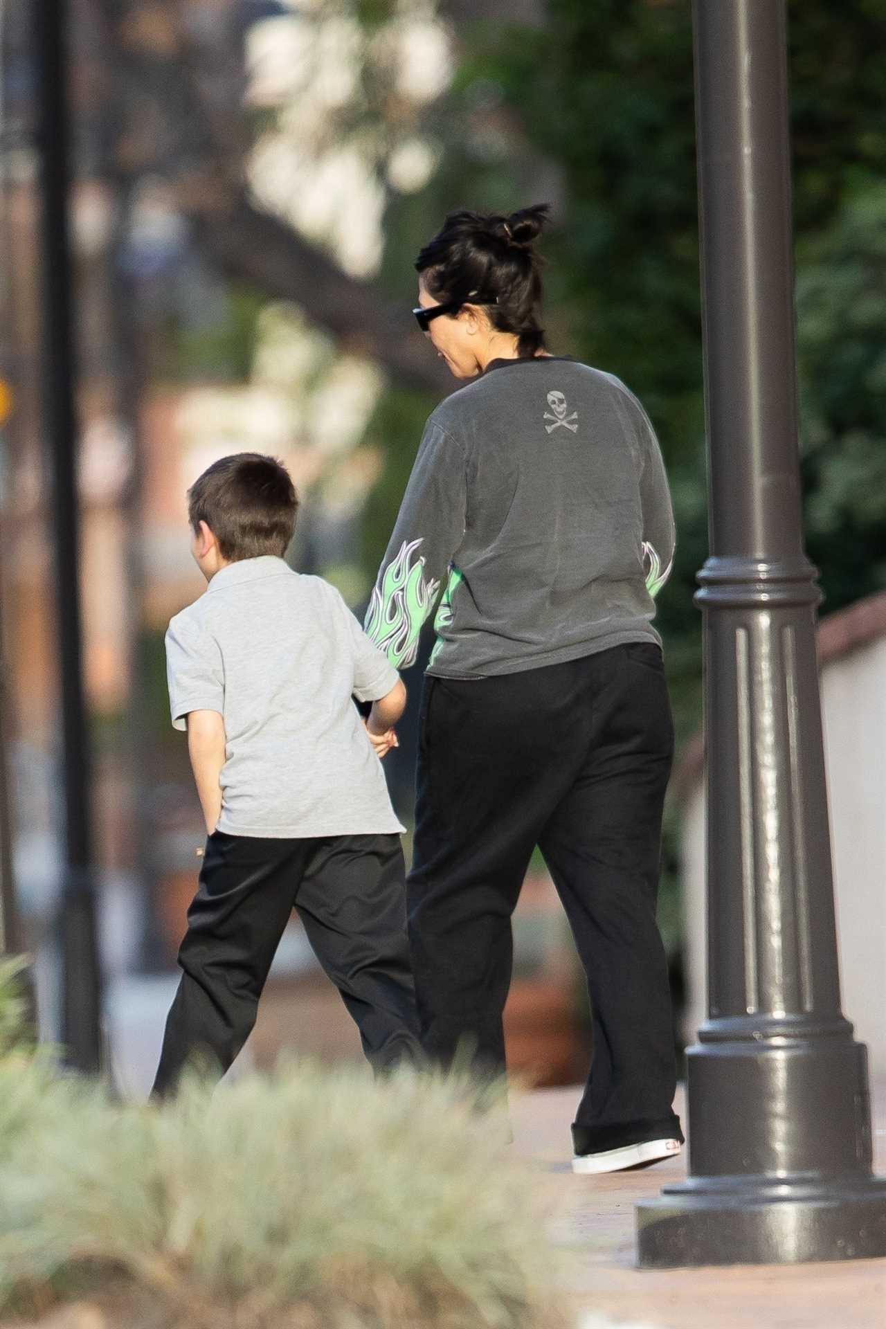 Kourtney Kardashian grabs Reign’s hand as she takes feisty son, 8, and daughter Penelope, 10, to the dentist’s office