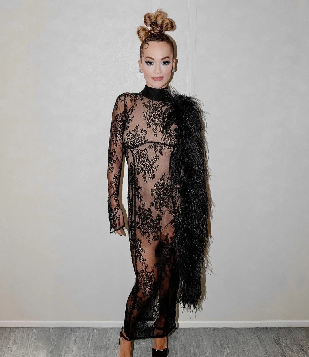 Rita Ora drives fans wild in sheer lace dress backstage at The Masked Singer