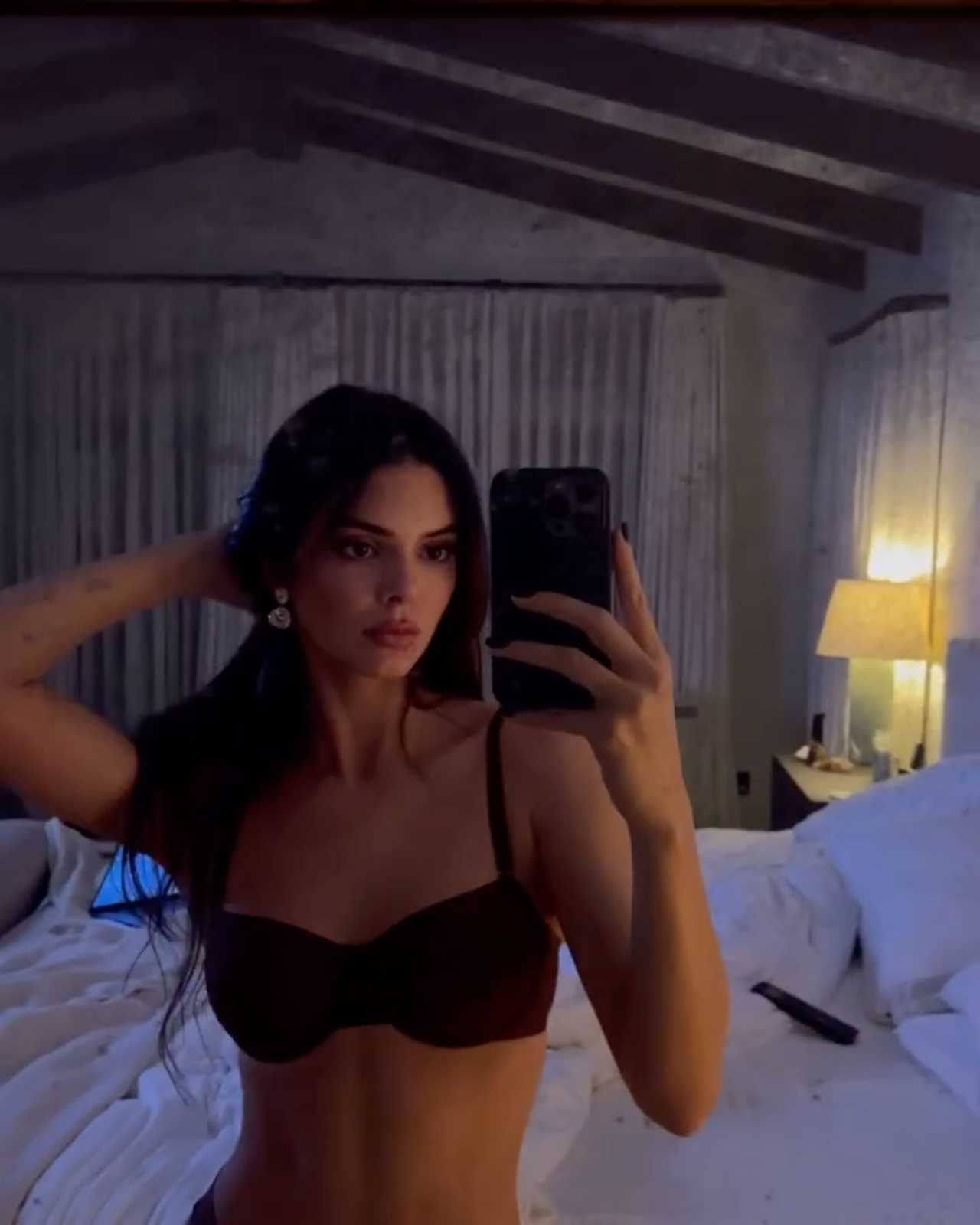 Kendall Jenner goes topless and shows off major underboob in NSFW new video after rumors model got ‘plastic surgery’