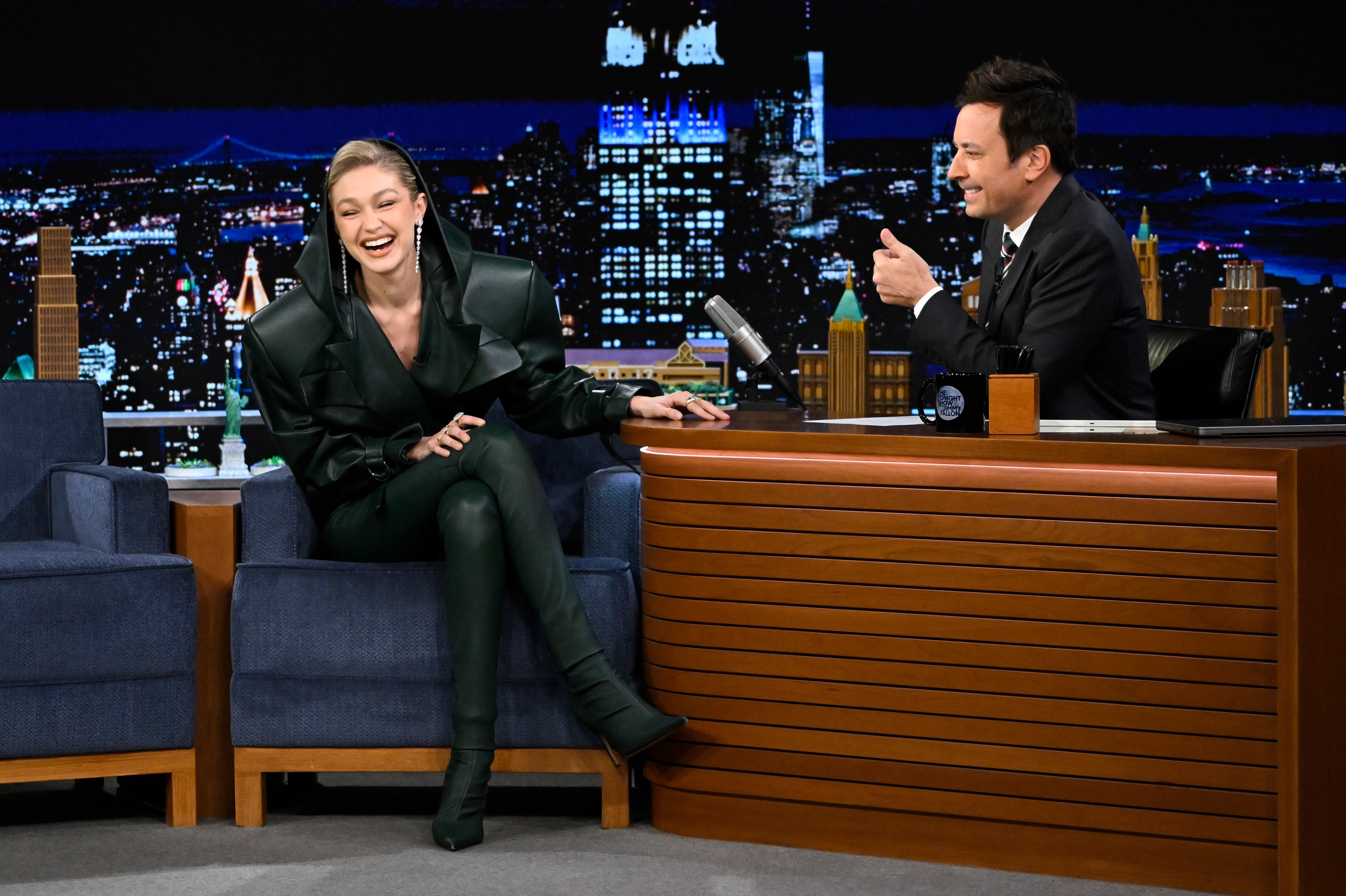 Model Gigi Hadid rocks 80’s inspired green leather two-piece during Tonight Show appearance