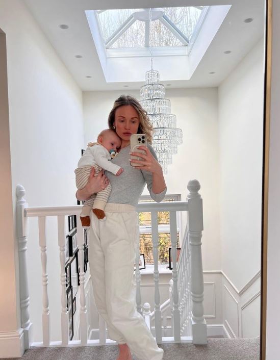 Jorgie Porter gives rare look inside her huge home as she poses with baby Forest in all-white outfit