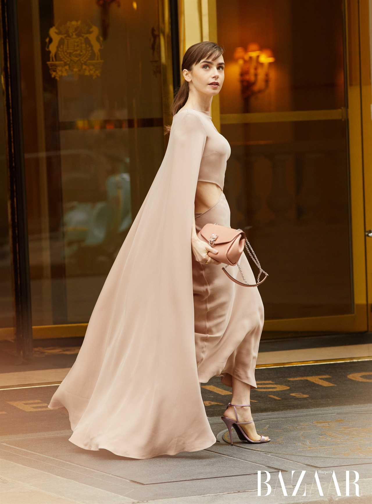 Emily In Paris star Lily Collins, 33, wows in cut-away gown and cape