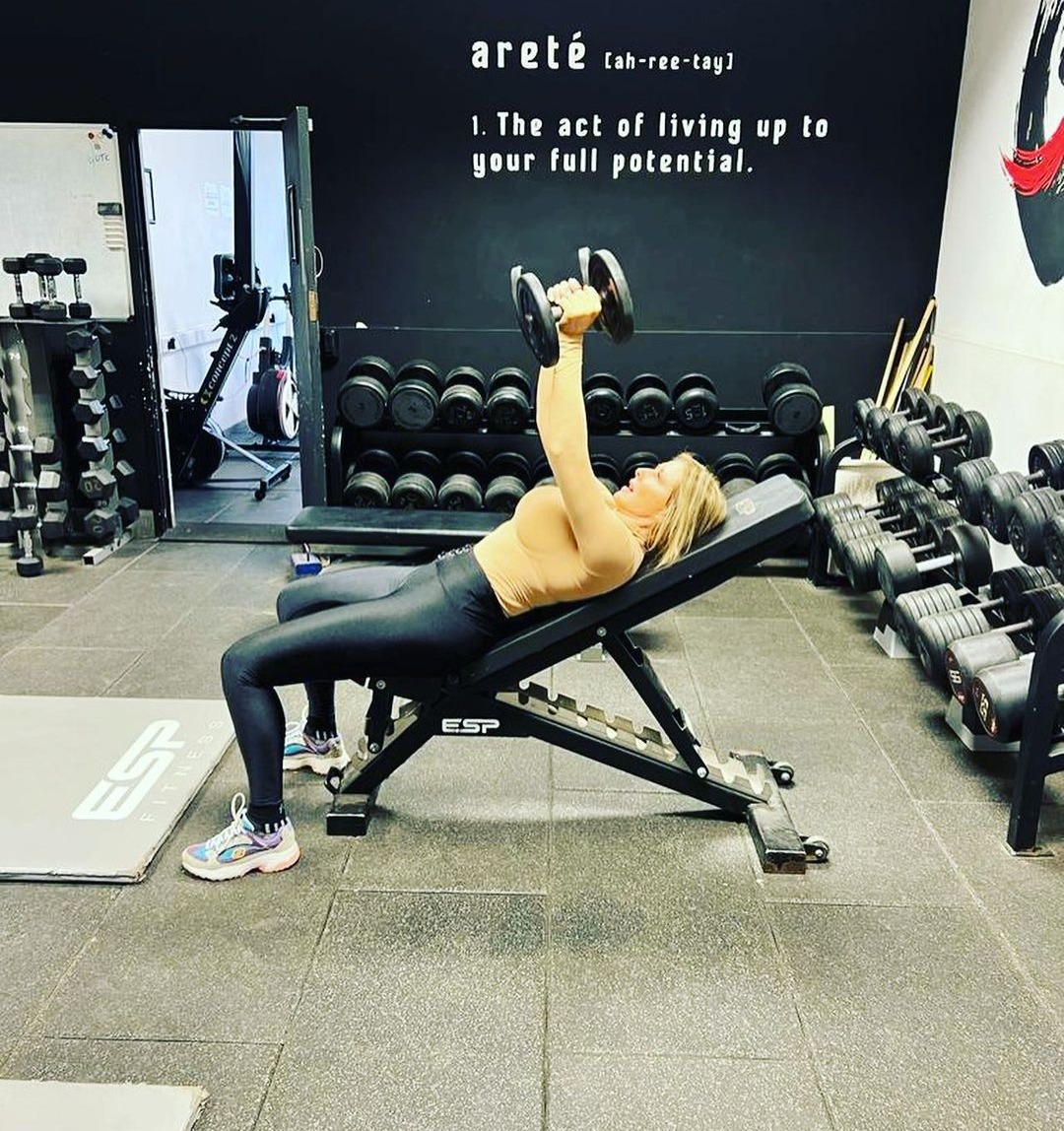 Carol Vorderman looks incredible in tight gym gear while lifting weights