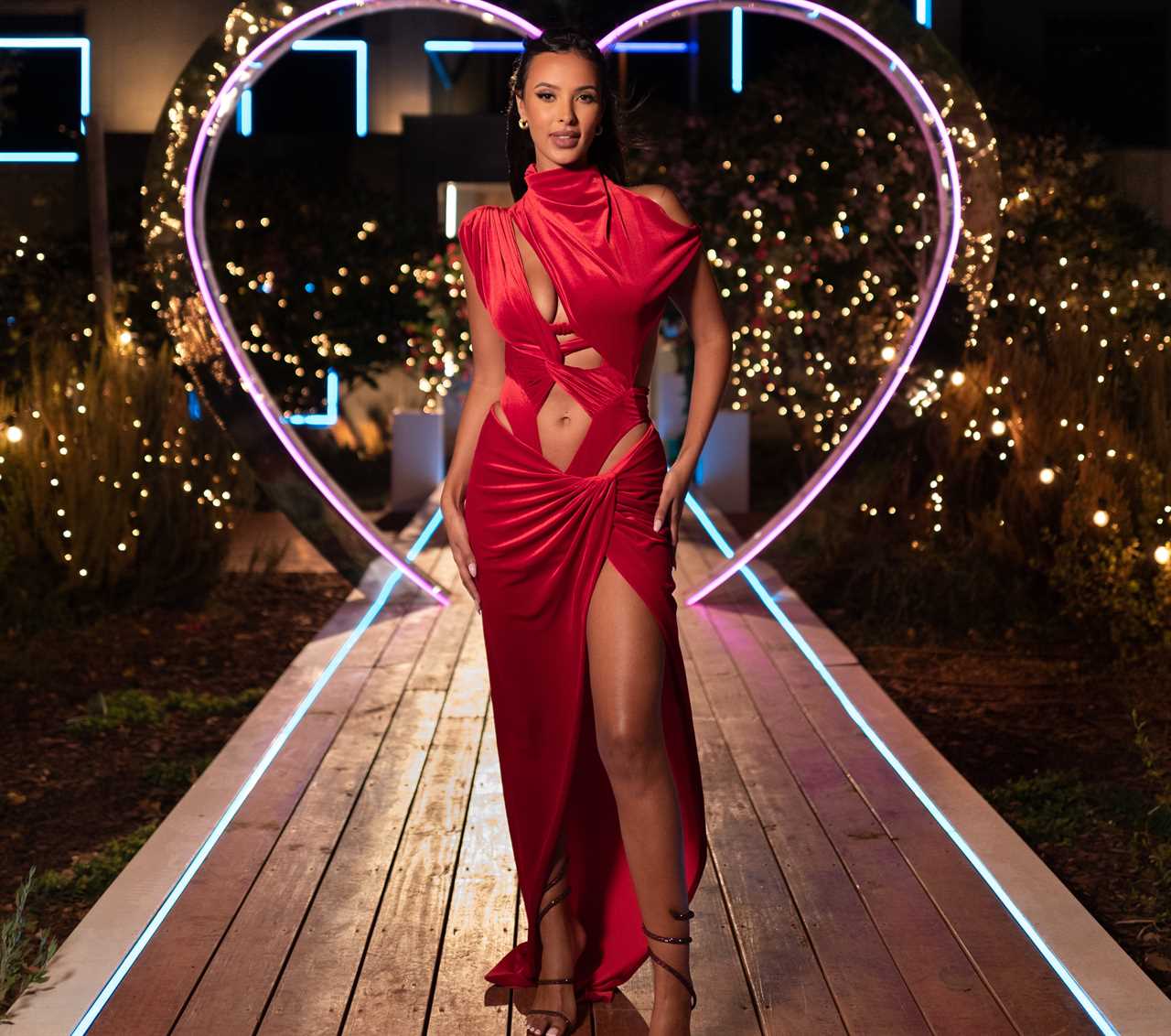 Love Island host Maya Jama looks incredible as she flashes her legs in plunging hooded thigh-split dress