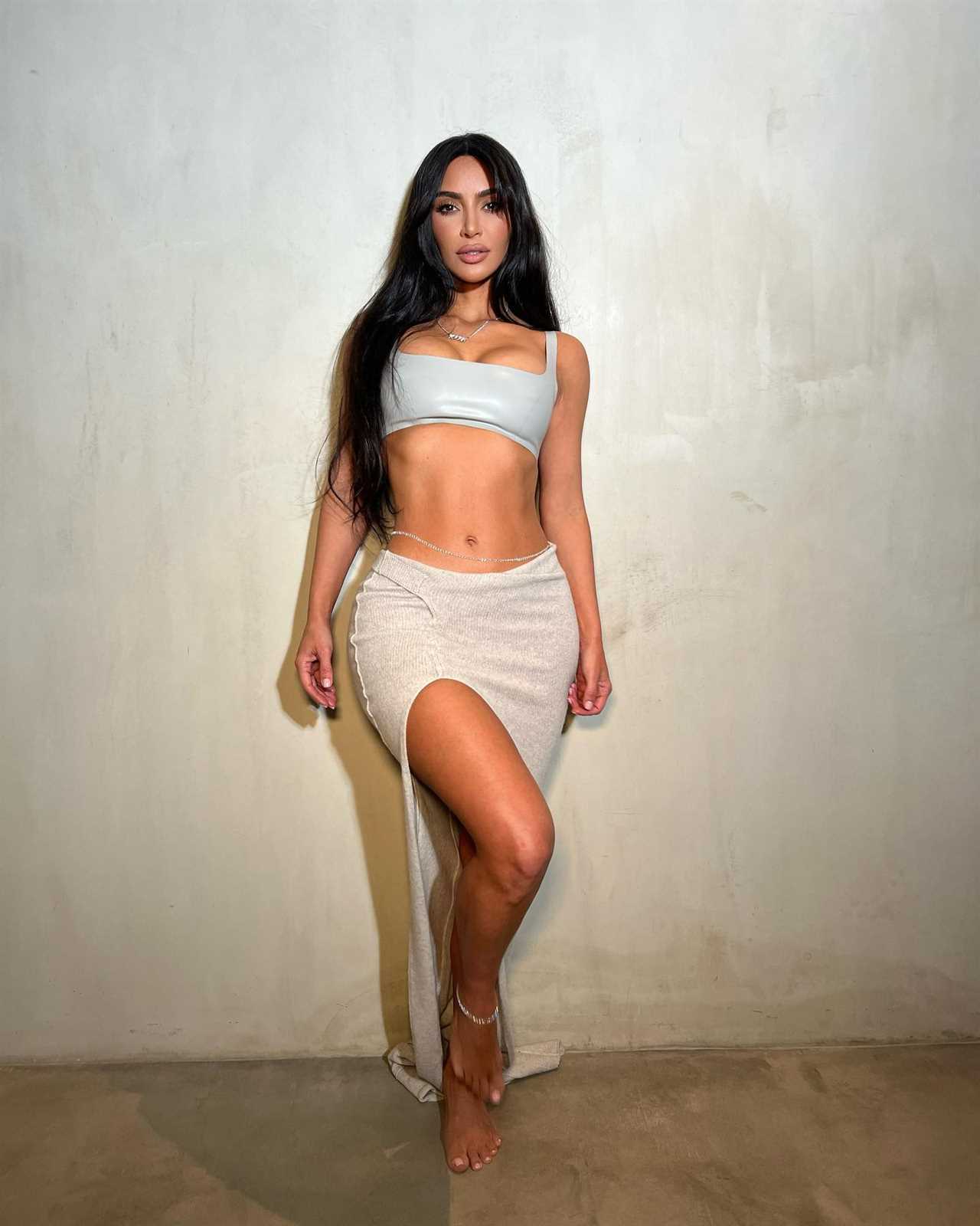 Kim Kardashian shows off her curves in see-through lace dress for sexy pic after fans claim she got ‘secret procedure’