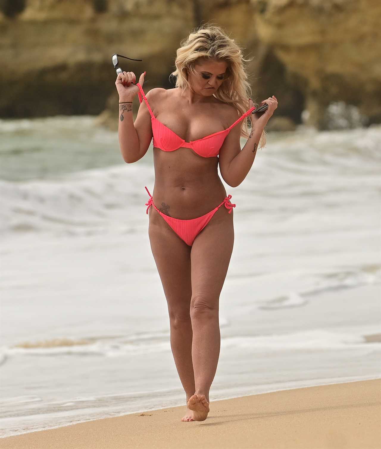 Danniella Westbrook, 49, looks incredible as she strips off to neon pink thong bikini on the beach in Portugal