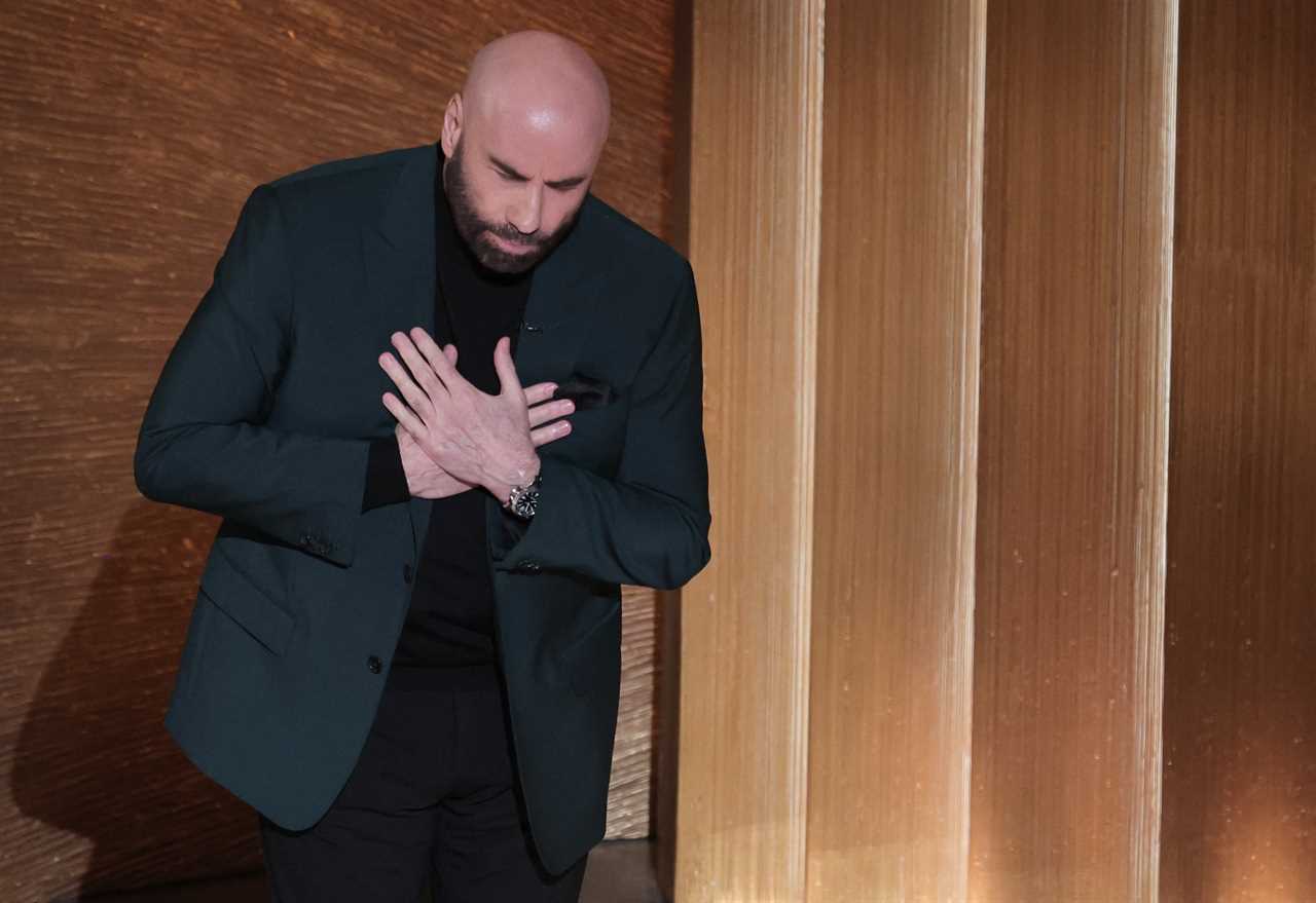 John Travolta breaks down in a puddle of tears on Oscars stage as he introduces Olivia Newton-John’s In Memoriam tribute