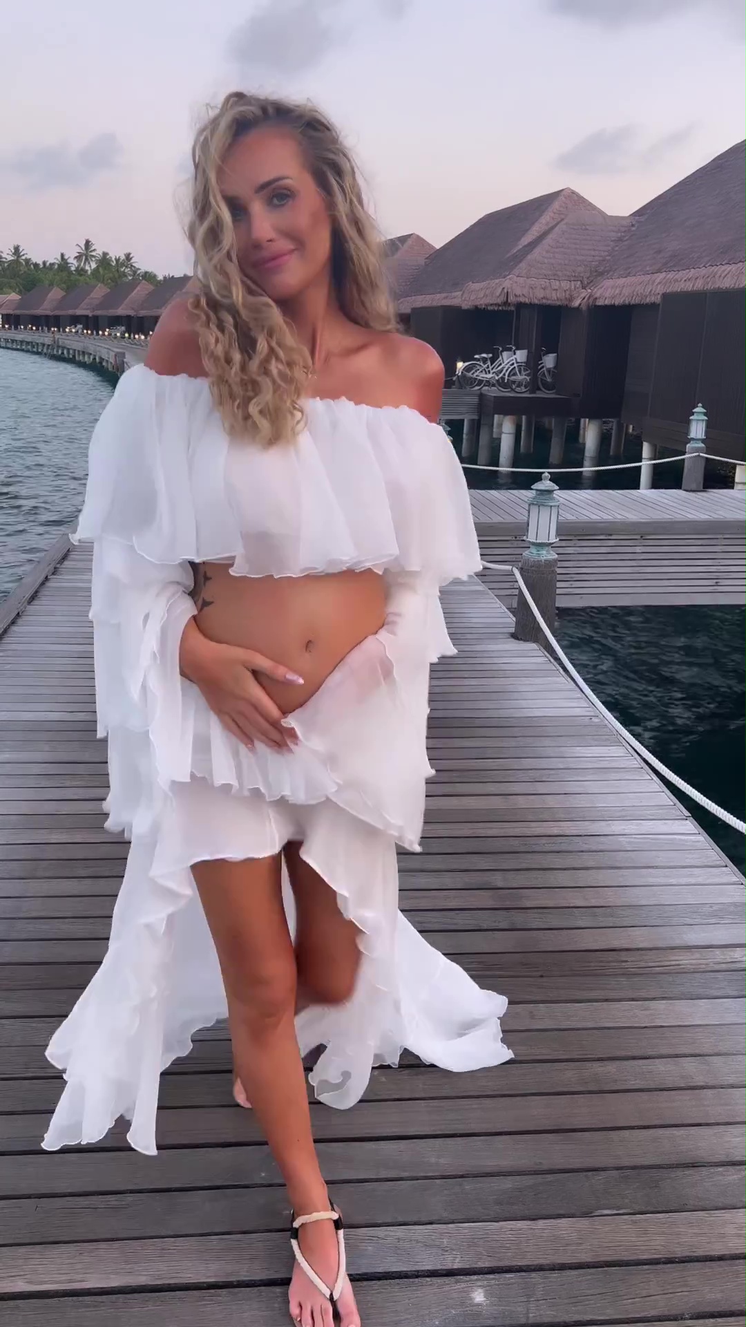 Love Island’s Laura Anderson hits back at body shamers as she shows off baby bump in the Maldives after Gary Lucy split