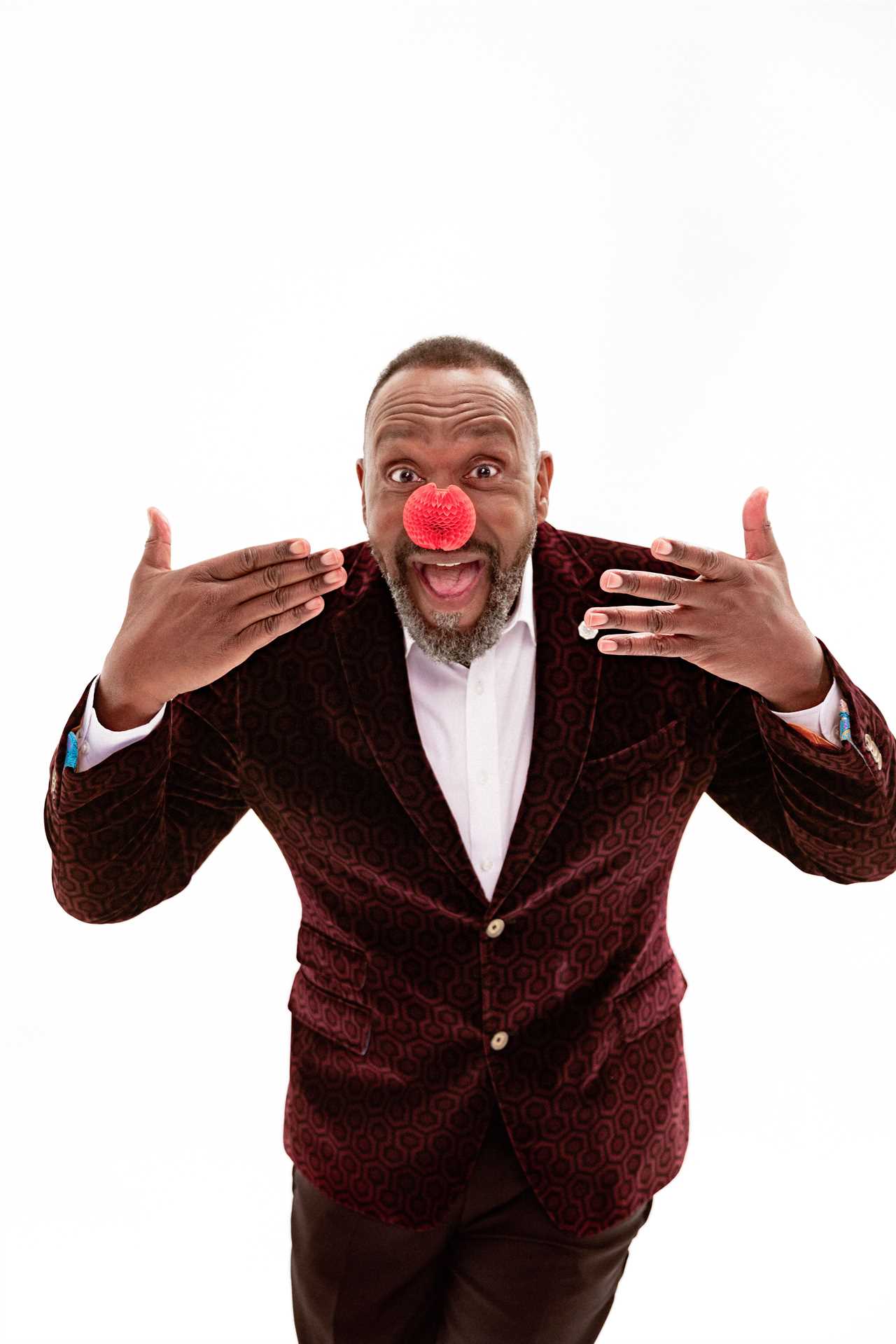 LONDON, UNITED KINGDOM - JANUARY 2023: Comedian and actor, Lenny Henry supports Red Nose Day 2023 by wearing the latest Nose, this year being provided by Amazon. Taken during the filiming of the New Nose Launch Film in London on the 16th January 2023. (Photo by Richard Davenport/Comic Relief)