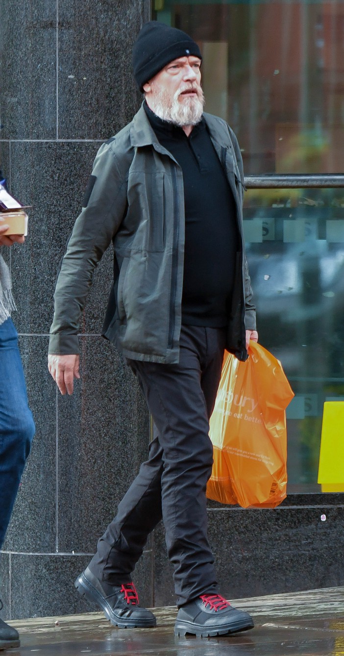 EXCLUSIVE: * Web Set Fee 250 GBP * * Print Fees To Be Agreed * Ex Eastenders Star Adam Woodyatt Picks Up A Snack At Sainsburys In Manchester, Where He Is Starring In My Fair Lady. The actor sported a large beard as he was spotted leaving the supermarket in Manchester city centre. Adam appeared to be channeling his "Homeless" Ian Beale character as he's decided to grow out his beard. Pictured: Adam Woodyatt Ref: SPL5532321 250323 EXCLUSIVE Picture by: SplashNews.com Splash News and Pictures USA: +1 310-525-5808 London: +44 (0)20 8126 1009 Berlin: +49 175 3764 166 photodesk@splashnews.com World Rights