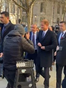 Prince Harry smiles as he makes surprise appearance at court for privacy hearing