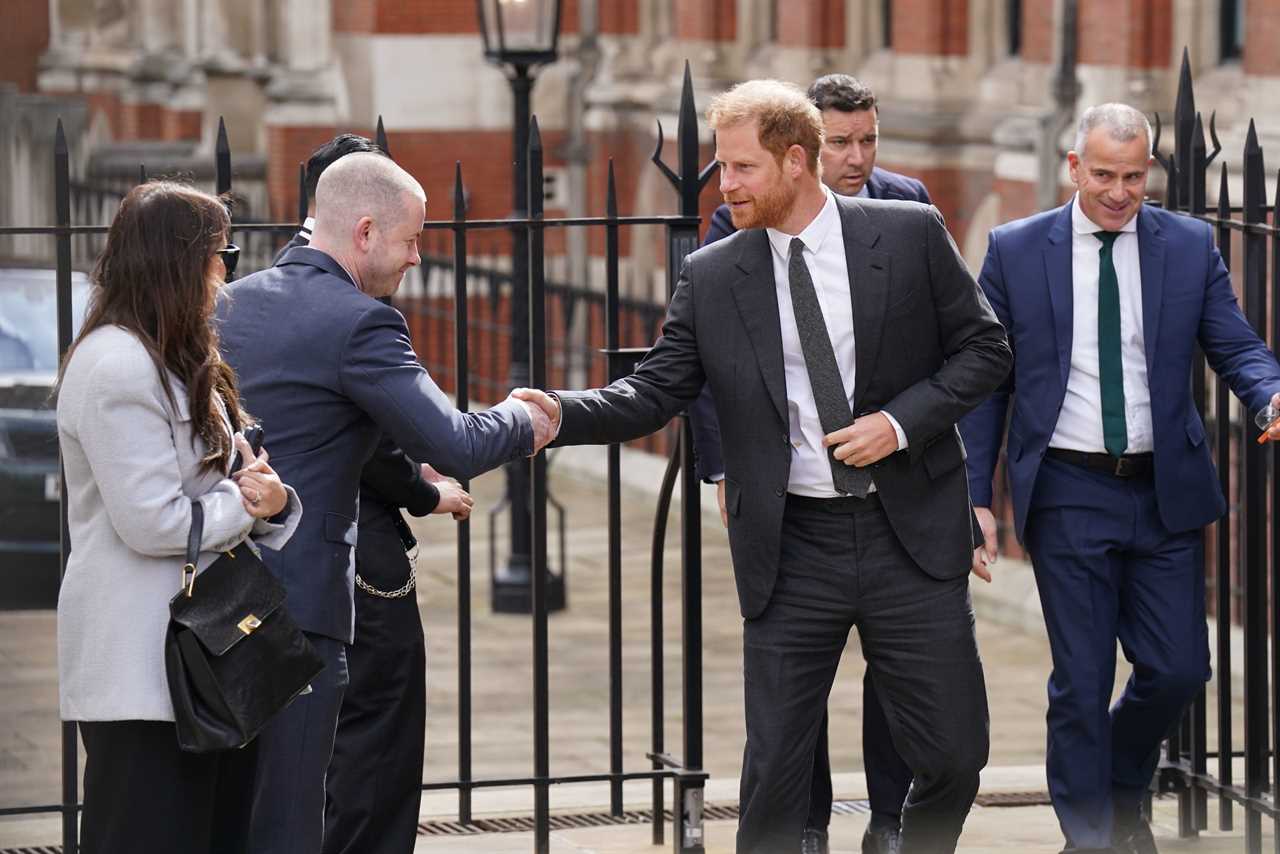 Prince Harry arrives for another day in court for privacy hearing flanked by security