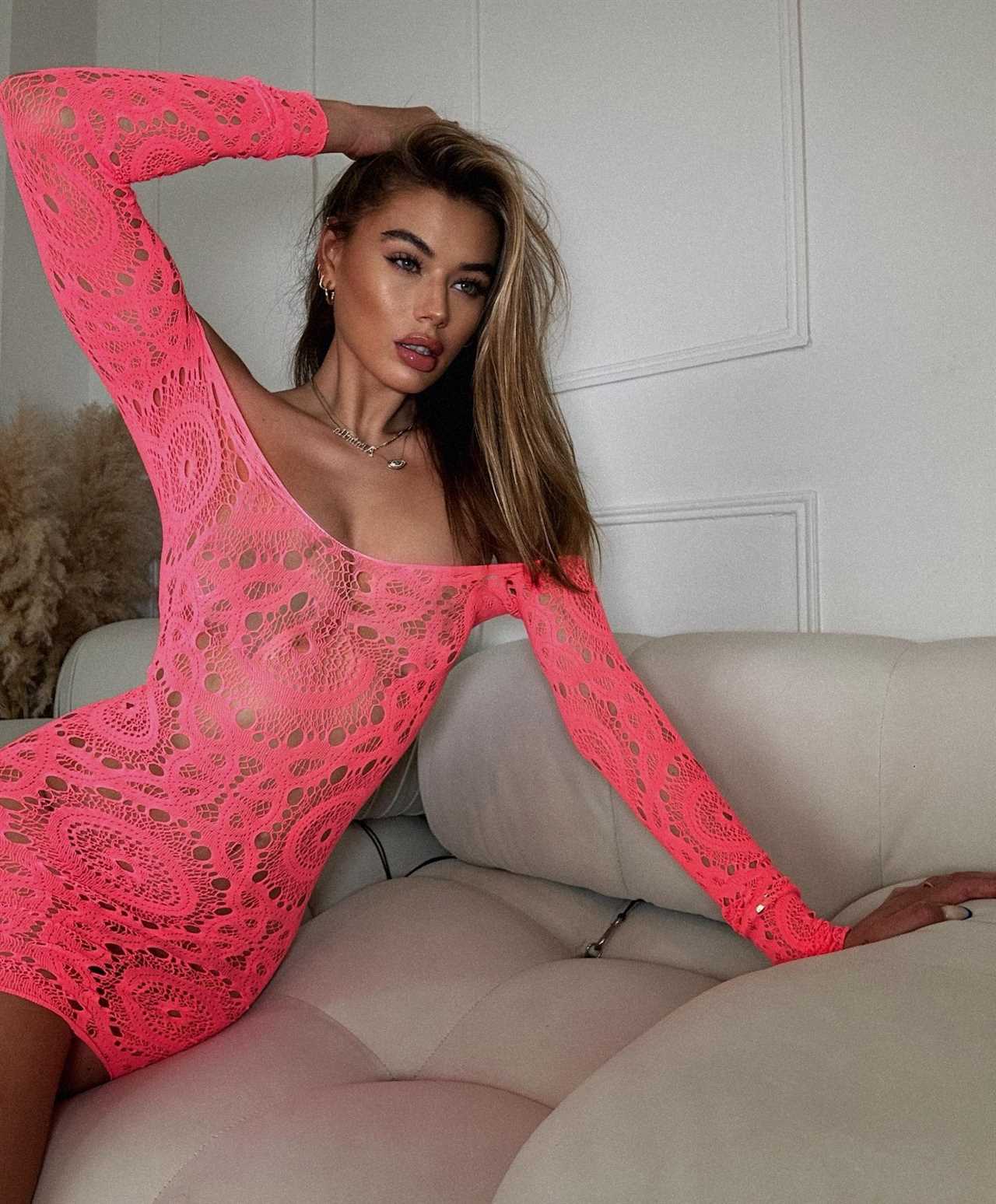 Love Island’s Arabella Chi ditches her underwear to pose in totally see-through pink dress