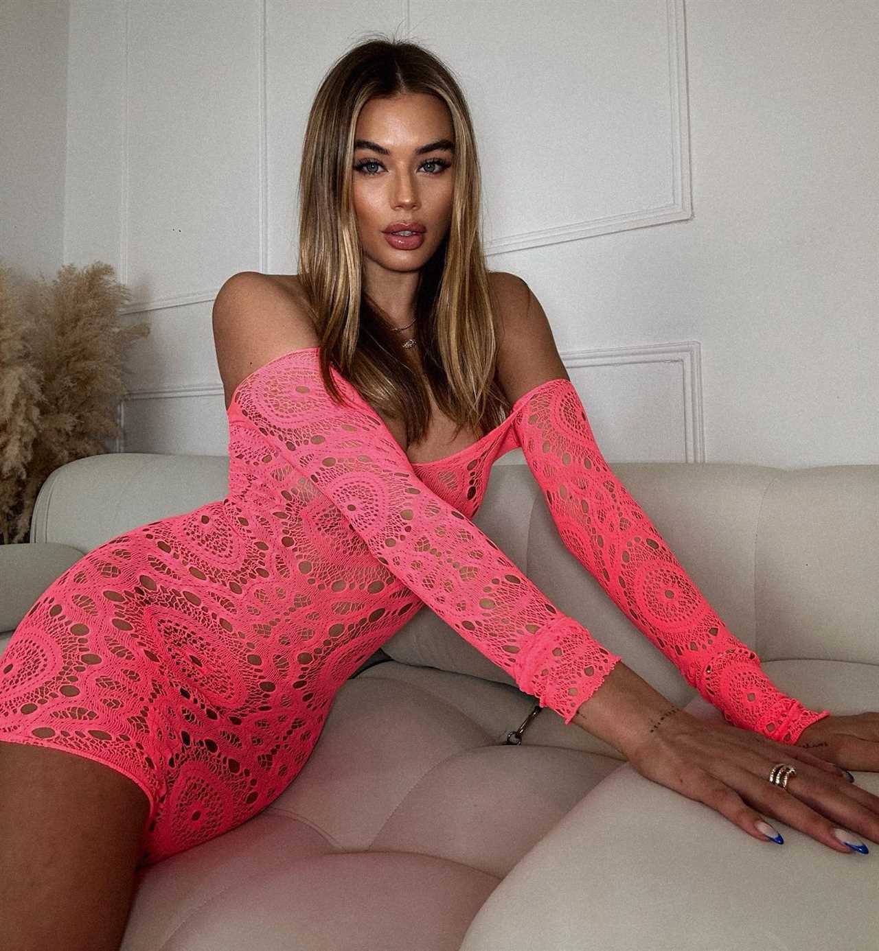 Love Island’s Arabella Chi ditches her underwear to pose in totally see-through pink dress