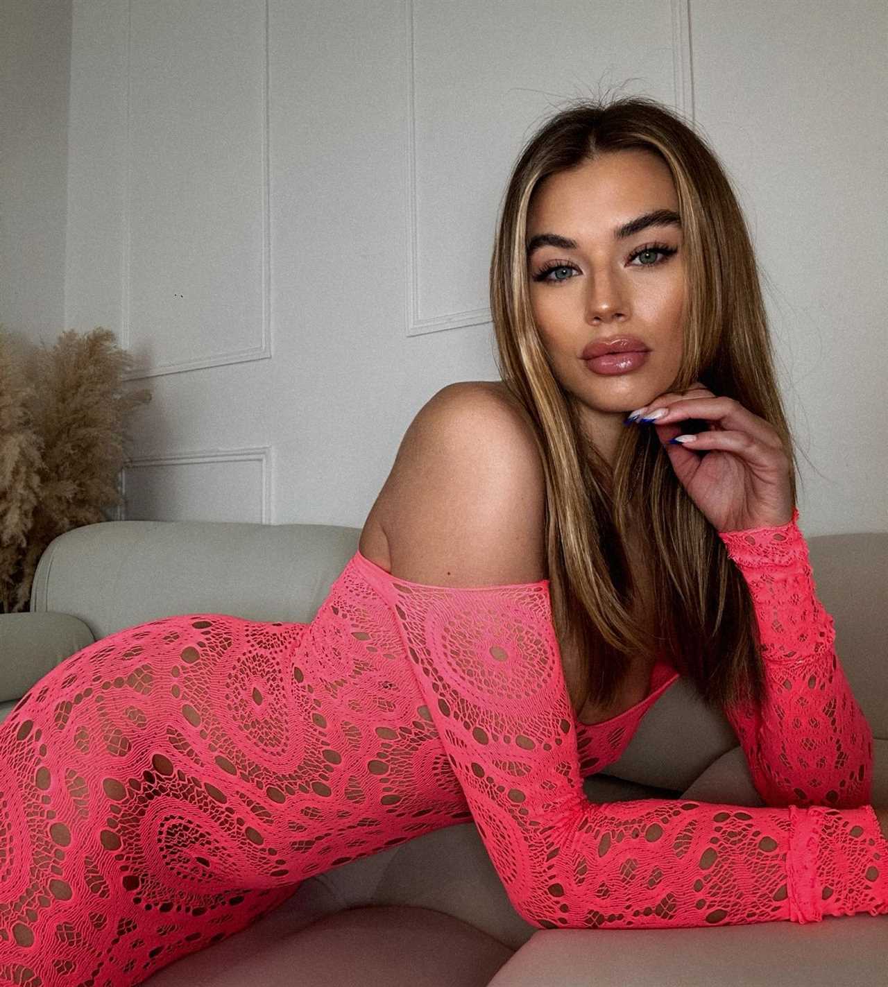 Love Island’s Arabella Chi ditches her underwear to pose in totally see-through pink dress