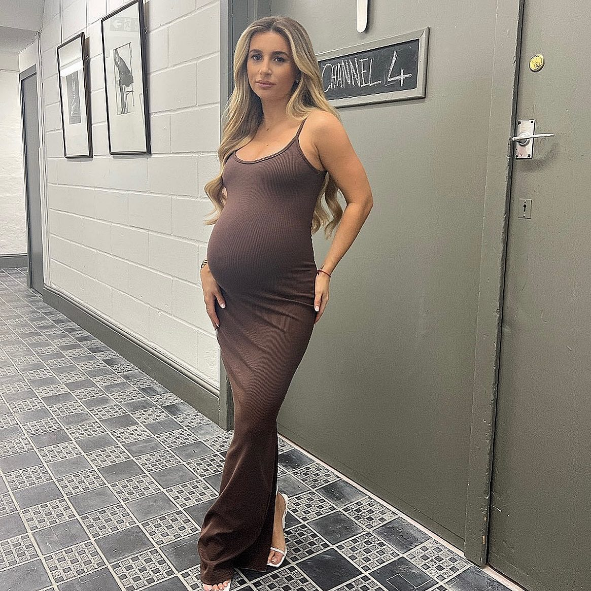 Pregnant Dani Dyer shows off her growing baby bump in figure-hugging dress as she nears due date