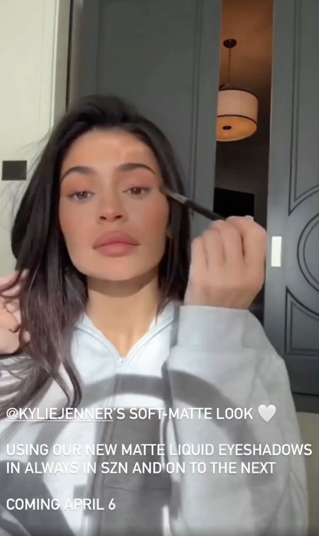 Kylie Jenner reveals her real eye lashes and flaunts her massive pout as she shows fans new makeup line for home video