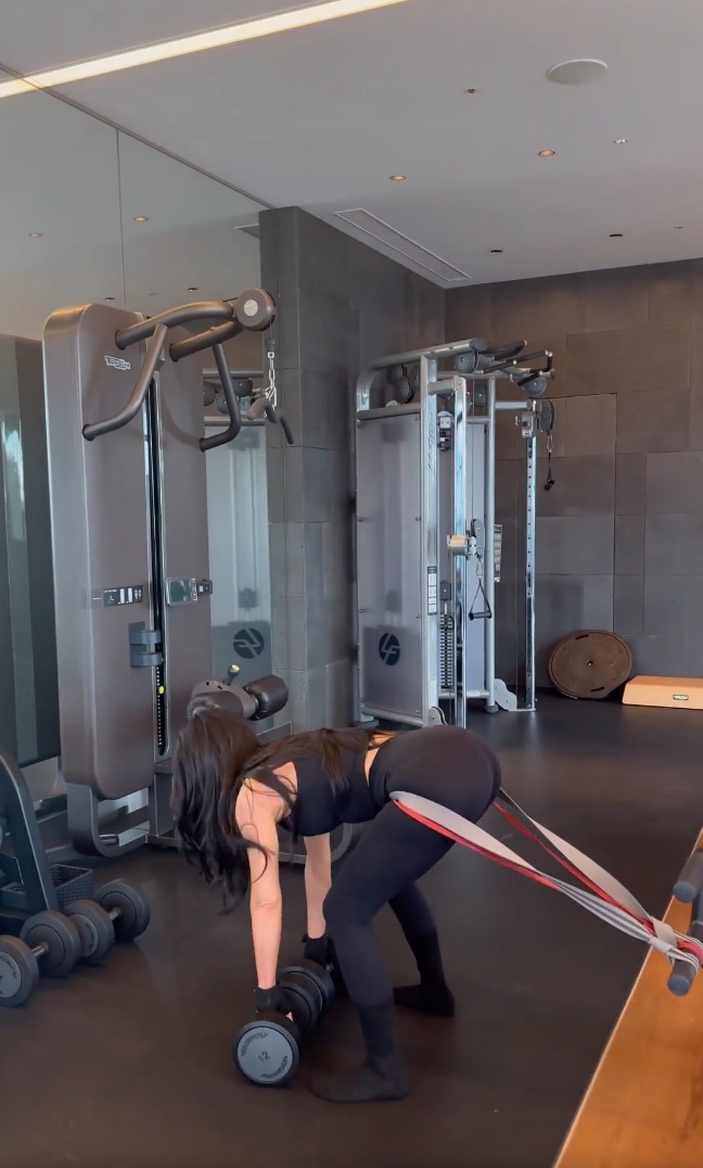 Kim Kardashian flaunts her butt in tight black leggings and crop top during brutal workout in new video from Japan trip