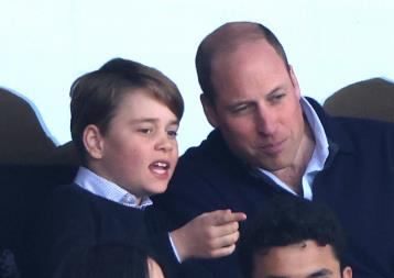 Animated Prince George is gripped by the action as dad William takes him to watch his beloved Aston Villa