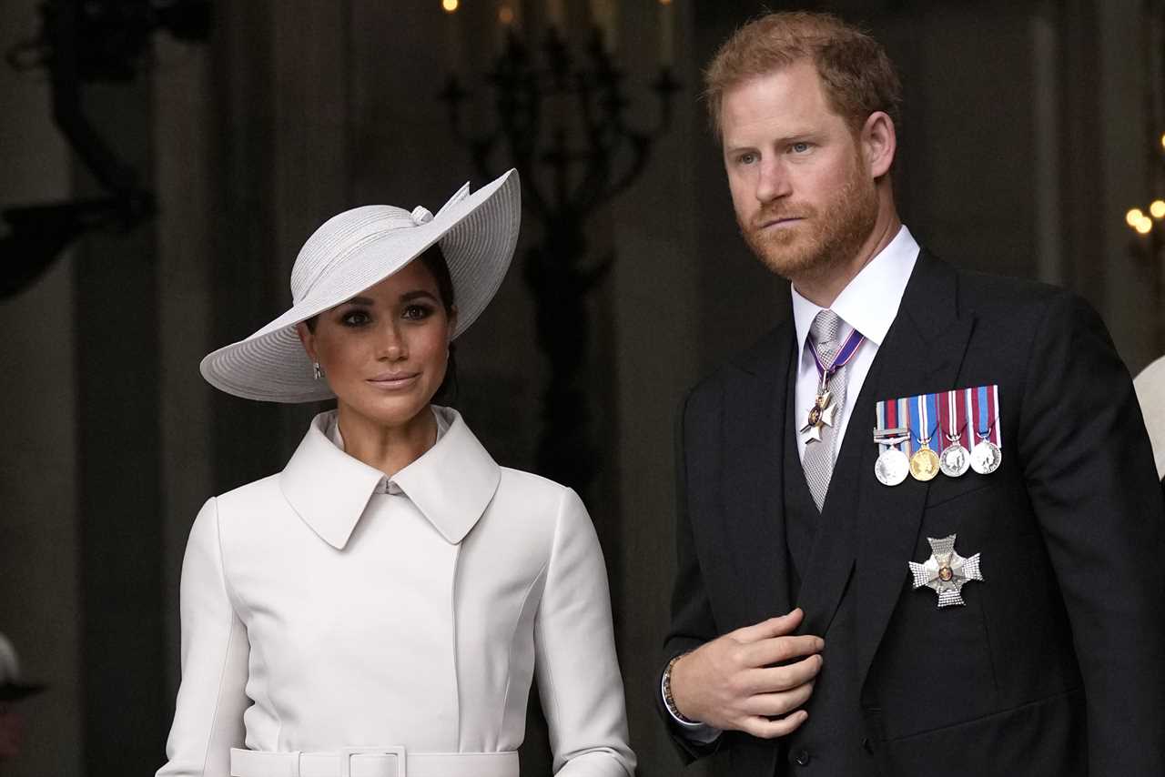 Prince Harry and Meghan Markle, Duke and Duchess of Sussex leave after a service of thanksgiving for the reign of Queen Elizabeth II at St Paul's Cathedral in London, Friday, June 3, 2022. Buckingham Palace says Prince Harry will attend the Coronation service of his father, King Charles III, at Westminster Abbey on May 6, setting aside months of speculation about his presence. Harry's wife Meghan, the Duchess of Sussex, will remain in California with the couples two children, Prince Archie and Princess Lilibet, the palace said Wednesday, April 12, 2023. (AP Photo/Matt Dunham, Pool, File)