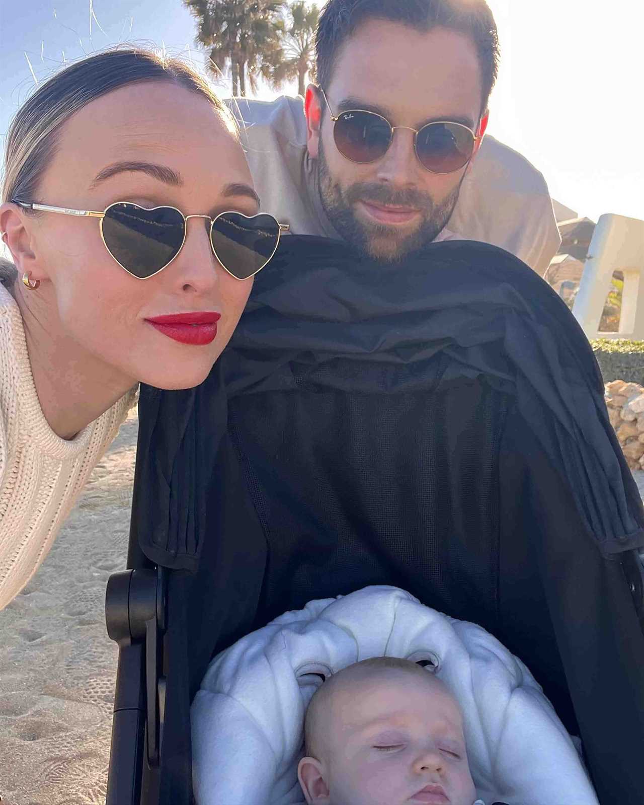 Jorgie Porter shows off natural beauty as she cuddles baby son on the beach on holiday