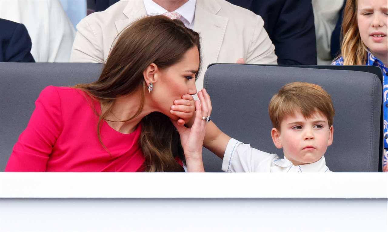LONDON, UNITED KINGDOM - JUNE 05: (EMBARGOED FOR PUBLICATION IN UK NEWSPAPERS UNTIL 24 HOURS AFTER CREATE DATE AND TIME) Prince Louis of Cambridge covers his mother Catherine, Duchess of Cambridge's mouth with his hand as they attend the Platinum Pageant on The Mall on June 5, 2022 in London, England. The Platinum Jubilee of Elizabeth II is being celebrated from June 2 to June 5, 2022, in the UK and Commonwealth to mark the 70th anniversary of the accession of Queen Elizabeth II on 6 February 1952. (Photo by Max Mumby/Indigo/Getty Images)