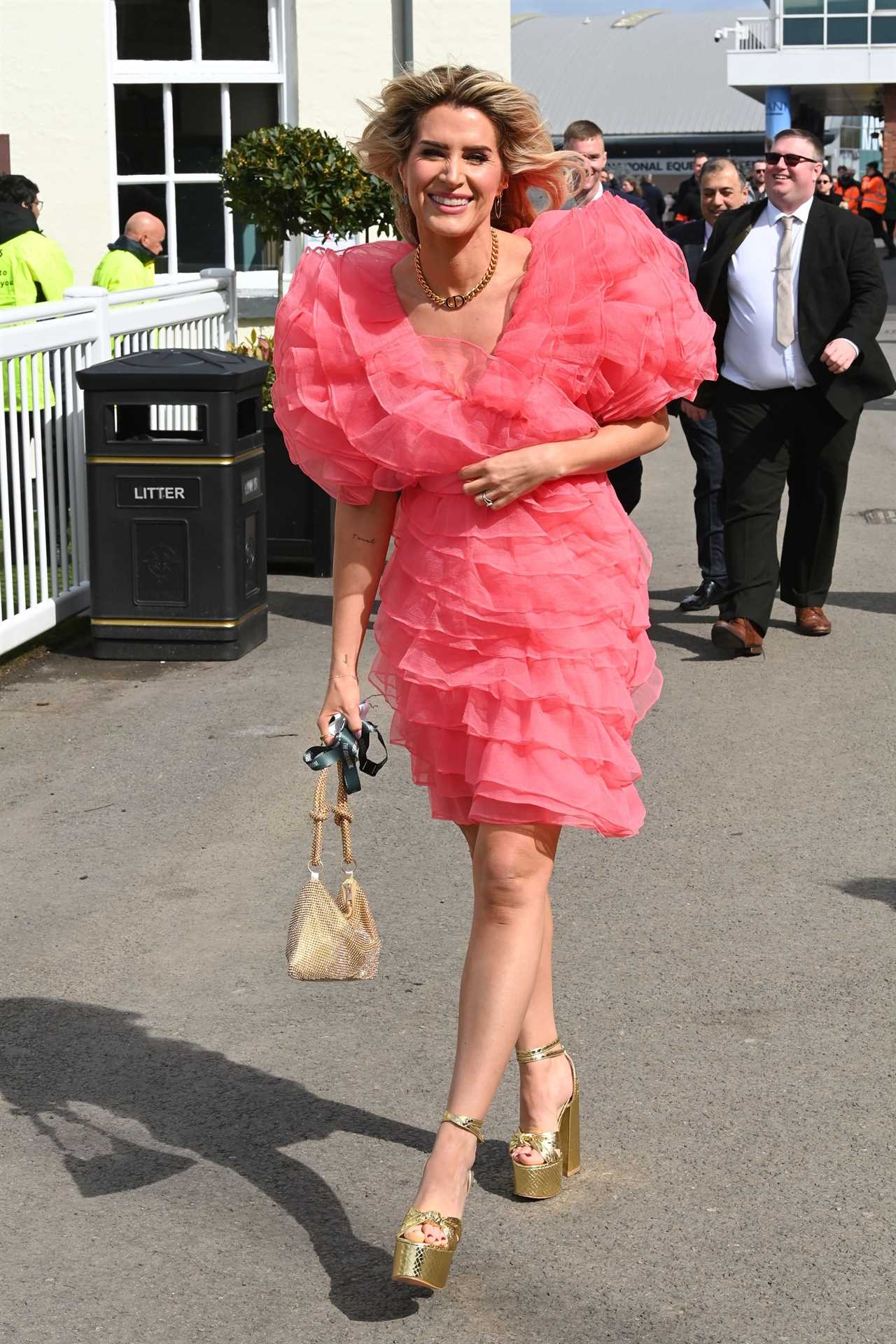 Sarah Jayne Dunn stuns as she goes braless in bright pink dress for day at the races