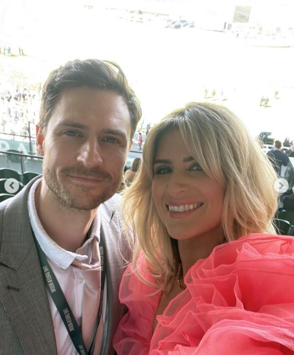 Sarah Jayne Dunn stuns as she goes braless in bright pink dress for day at the races