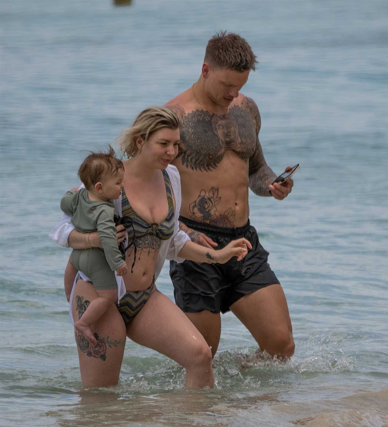 Olivia Bowen looks amazing in new plunging bikini as she hits the beach again on holiday with hubby Alex and son Abel