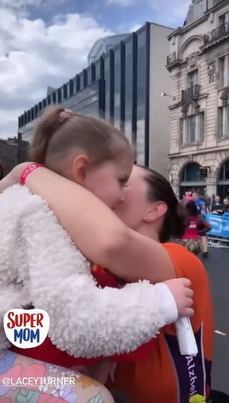 EastEnders star Lacey Turner breaks down in tears as she hugs her husband and daughter after emotional London Marathon