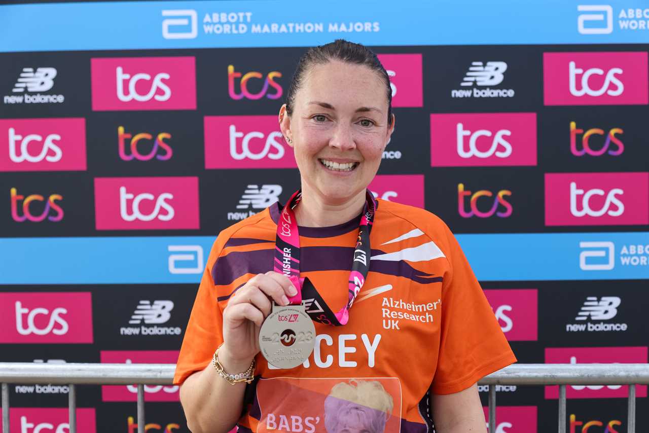 EastEnders star Lacey Turner breaks down in tears as she hugs her husband and daughter after emotional London Marathon