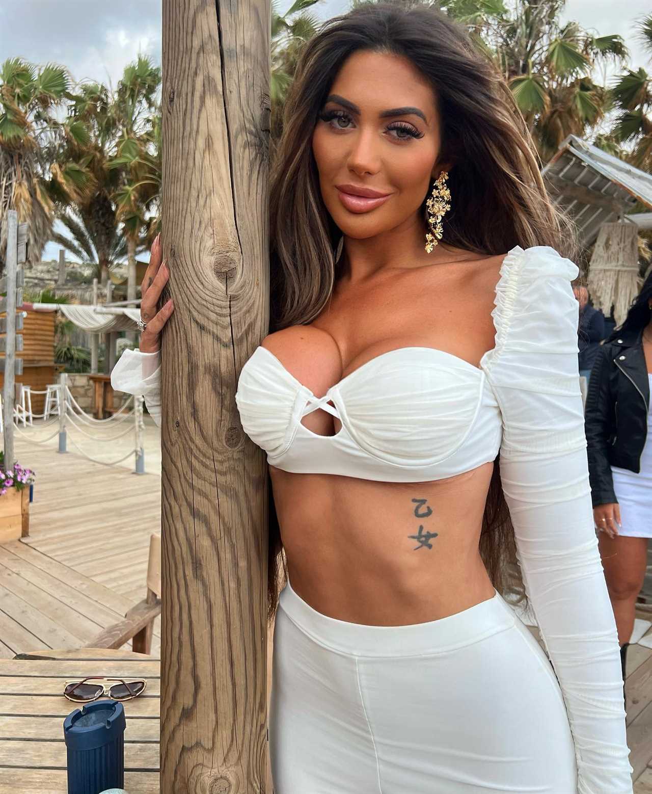 Chloe Ferry looks amazing as she almost bursts out of tiny black bikini after getting implant warning