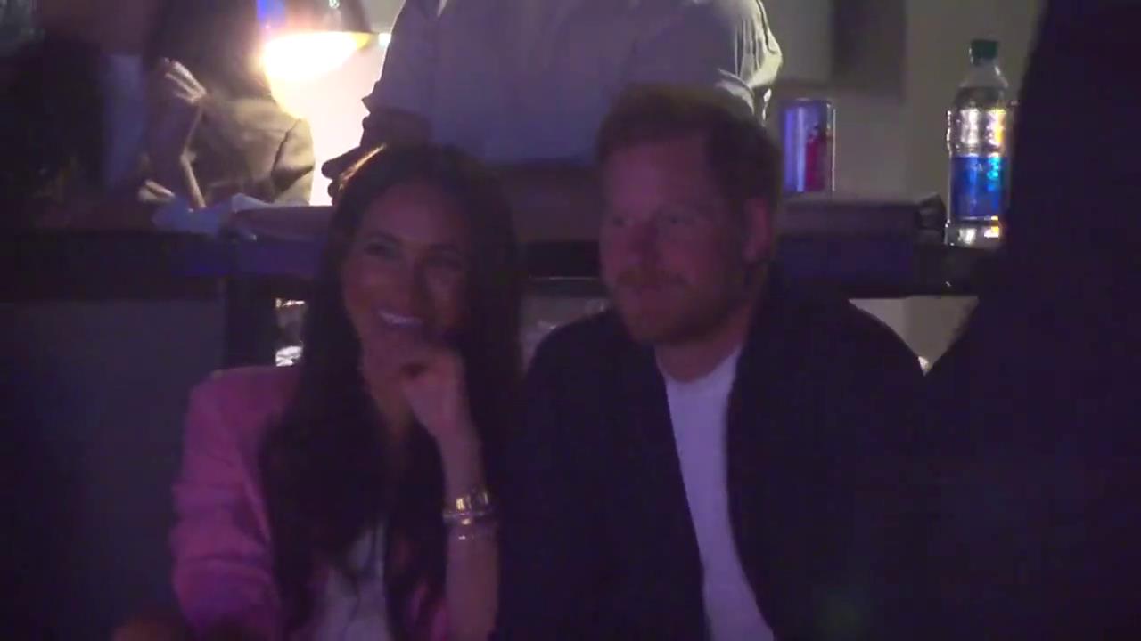 Meghan Markle and Prince Harry giggle and pull faces at Lakers basketball game after coronation snub